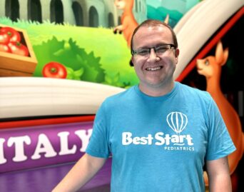 guy wearing glasses and a blue shirt with the Best Start Logo on it